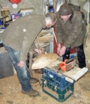 Loughie checks on the planing of Brian's hull. Photo: Stephen Ryan